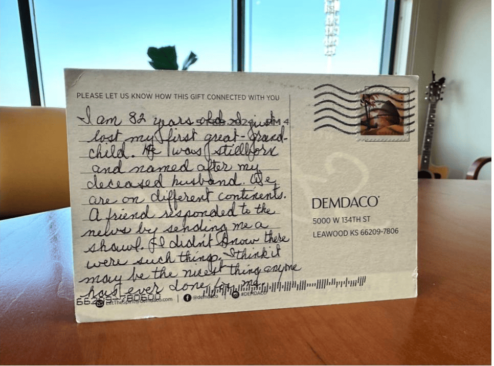 Customer testimonial postcard from 82-year-old great-grandmother about receiving comfort shawl
