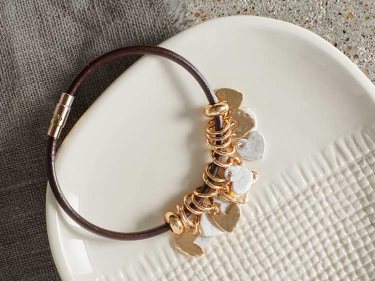 Gold and silver bracelet with heart charms